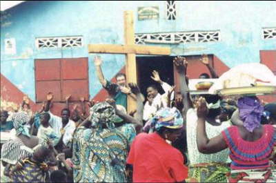 HENRY PREACHING TO VILLAGE CROWD